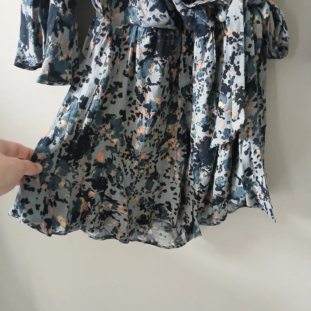 Free People Size S All the Right Ruffles Blue Floral Romper Flutter Sleeve Vneck